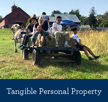 Students on a hay ride. Tangible Personal Property Rollover